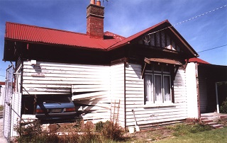 car crash into house