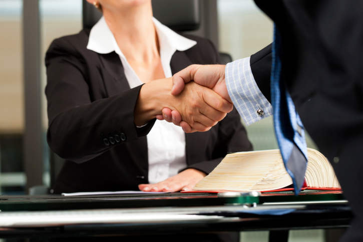 image of man and woman shaking hands