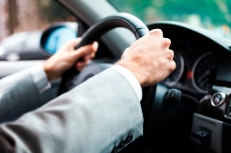 two hands on steering wheel