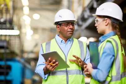 image of two workers wearing full protective gear